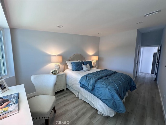 13361 El Dorado Unit 201K, Seal Beach, CA 90740 - bedroom featuring wood finished floors and recessed lighting