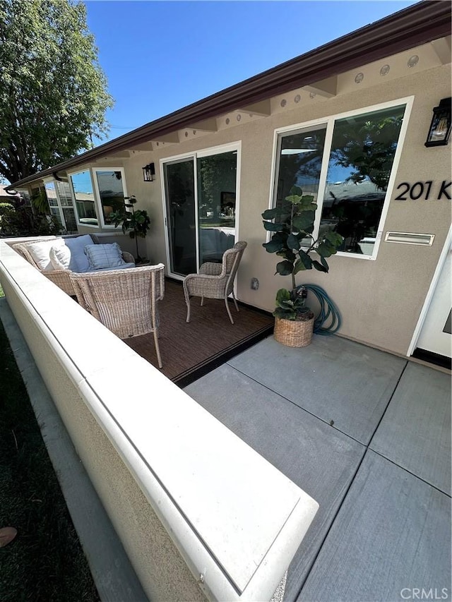 13361 El Dorado Unit 201K, Seal Beach, CA 90740 - view of patio / terrace featuring an outdoor hangout area