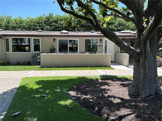 13361 El Dorado Unit 201K, Seal Beach, CA 90740 - view of front of home featuring a front yard and stucco siding