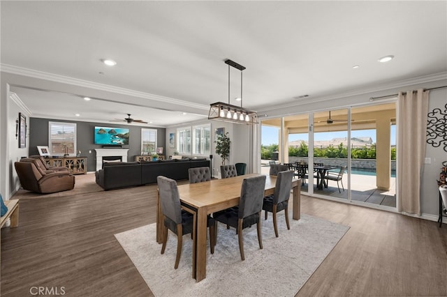 16671 Zest Ct, Riverside, CA 92503 - dining area with crown molding, wood finished floors, a ceiling fan, recessed lighting, and a fireplace