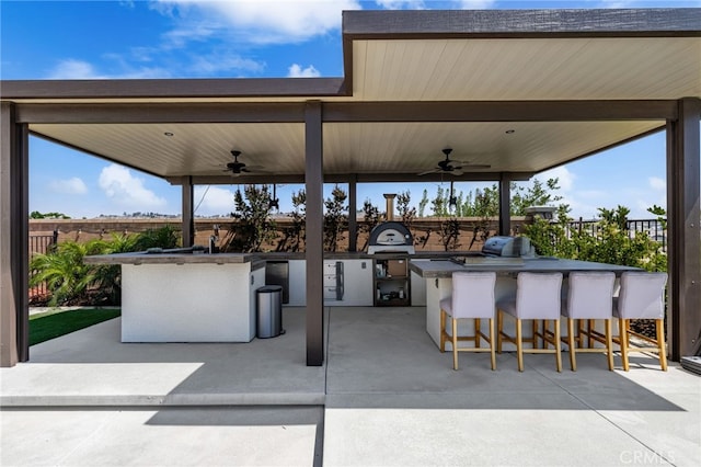 16671 Zest Ct, Riverside, CA 92503 - view of patio / terrace featuring ceiling fan and an outdoor kitchen