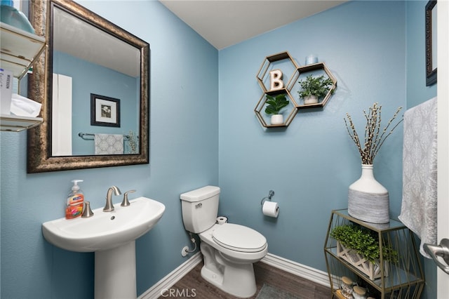 16671 Zest Ct, Riverside, CA 92503 - half bath featuring wood finished floors and toilet