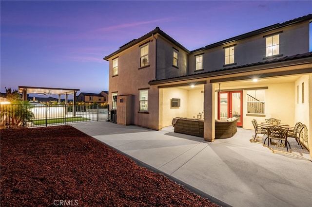 16671 Zest Ct, Riverside, CA 92503 - rear view of property with stucco siding, a patio area, and an outdoor hangout area