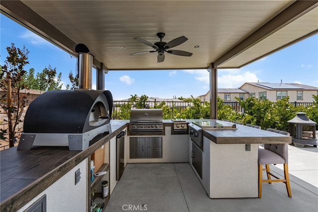 16671 Zest Ct, Riverside, CA 92503 - view of patio featuring exterior kitchen and a ceiling fan