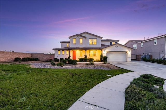 16671 Zest Ct, Riverside, CA 92503 - traditional-style house with driveway, a front lawn, stucco siding, an attached garage, and covered porch