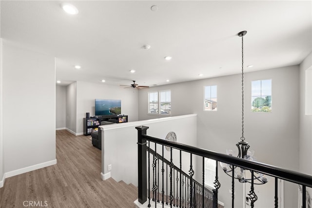 16671 Zest Ct, Riverside, CA 92503 - hallway with an upstairs landing, light wood finished floors, and recessed lighting