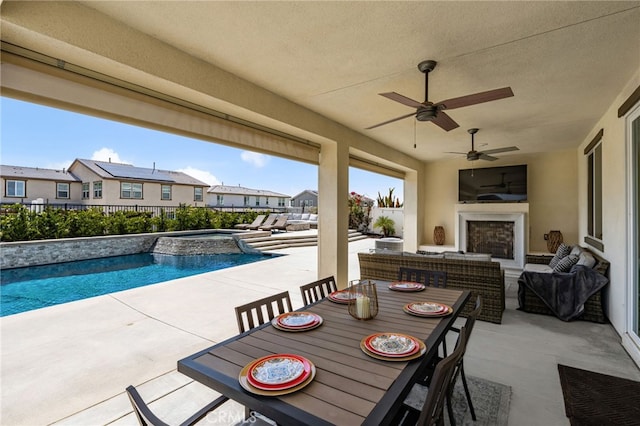 16671 Zest Ct, Riverside, CA 92503 - view of patio / terrace featuring a pool with connected hot tub, a residential view, ceiling fan, outdoor dining space, and an outdoor living space with a fireplace
