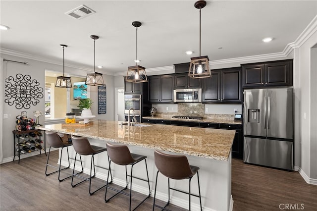 16671 Zest Ct, Riverside, CA 92503 - kitchen with appliances with stainless steel finishes, dark wood-style floors, a kitchen island with sink, backsplash, and recessed lighting