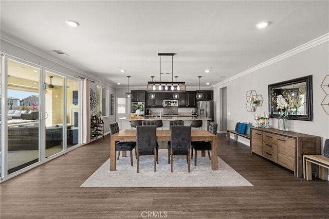 16671 Zest Ct, Riverside, CA 92503 - dining room featuring crown molding, dark wood finished floors, and recessed lighting