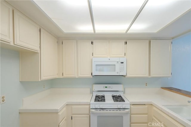 1430 Brett Pl Unit 12, San Pedro, CA 90732 - kitchen with white appliances and light countertops