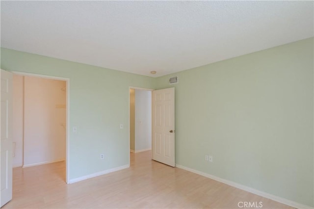 1430 Brett Pl Unit 12, San Pedro, CA 90732 - unfurnished bedroom with light wood-style floors and a spacious closet