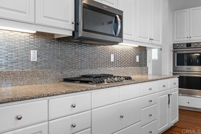 1837 Ashley Ave, Chula Vista, CA 91913 - kitchen featuring stainless steel appliances, white cabinets, tasteful backsplash, and light stone countertops