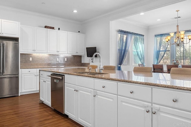 1837 Ashley Ave, Chula Vista, CA 91913 - kitchen with appliances with stainless steel finishes, a chandelier, light stone countertops, white cabinetry, and ornamental molding