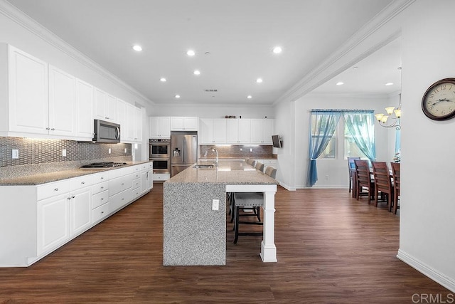1837 Ashley Ave, Chula Vista, CA 91913 - kitchen with stainless steel appliances, crown molding, a chandelier, backsplash, and white cabinets