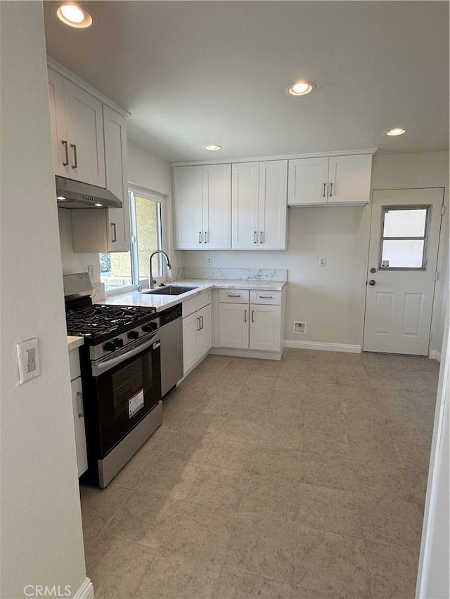 8567 Jasper St, Rancho Cucamonga, CA 91730 - kitchen featuring appliances with stainless steel finishes, exhaust hood, light countertops, white cabinets, and recessed lighting