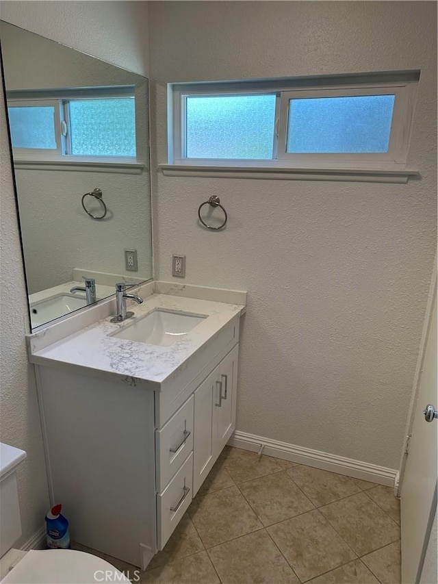 8567 Jasper St, Rancho Cucamonga, CA 91730 - half bathroom featuring vanity, tile patterned flooring, and a textured wall