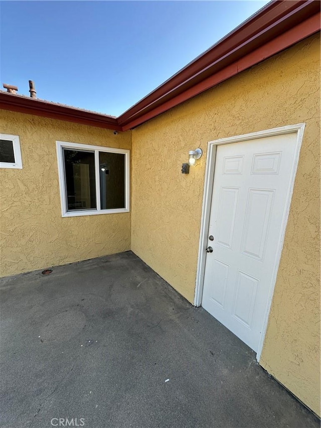 8567 Jasper St, Rancho Cucamonga, CA 91730 - view of exterior entry featuring stucco siding and a patio