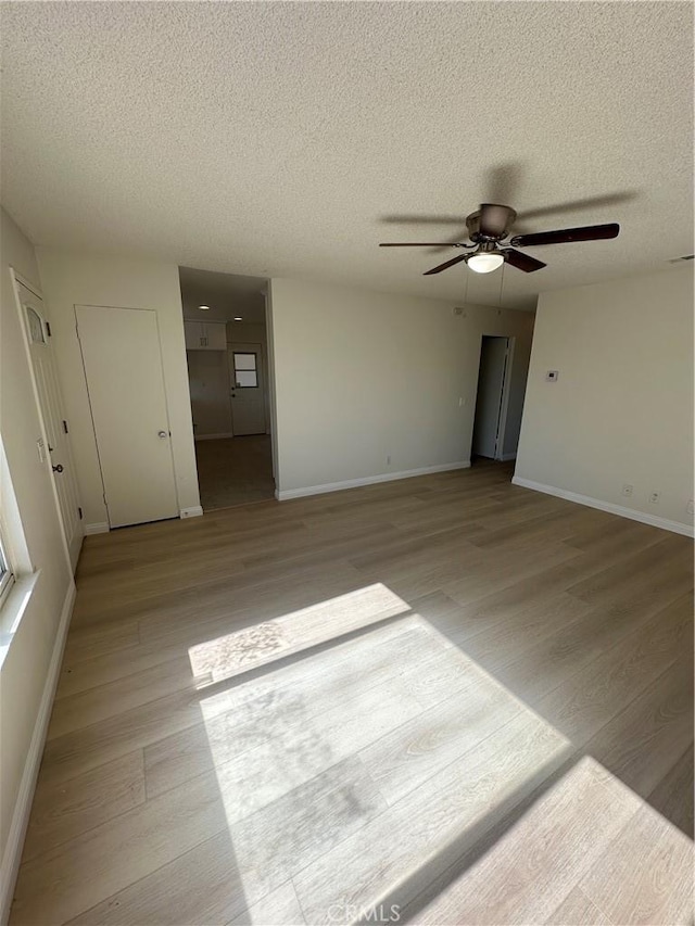 8567 Jasper St, Rancho Cucamonga, CA 91730 - spare room with light wood-style flooring, ceiling fan, and a textured ceiling