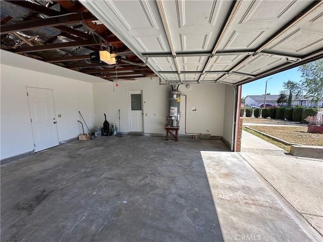 8567 Jasper St, Rancho Cucamonga, CA 91730 - garage featuring strapped water heater and a garage door opener