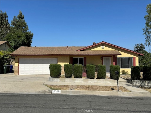 8567 Jasper St, Rancho Cucamonga, CA 91730 - single story home with concrete driveway, an attached garage, and stucco siding