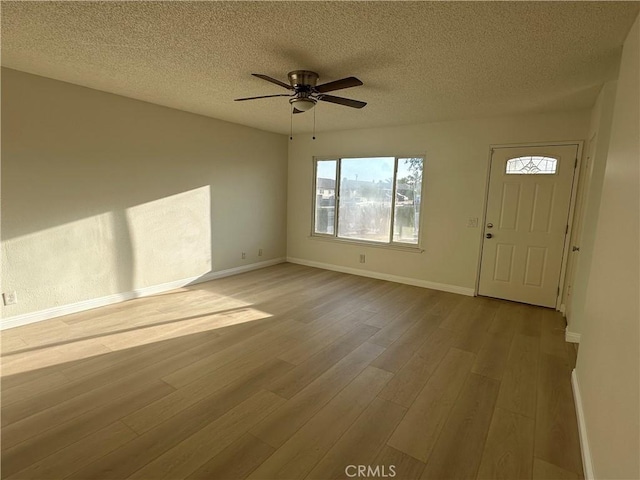 8567 Jasper St, Rancho Cucamonga, CA 91730 - foyer featuring wood finished floors, a textured ceiling, and ceiling fan