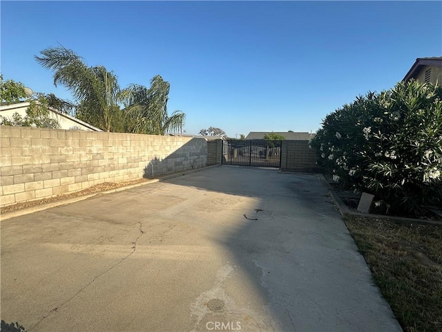 8567 Jasper St, Rancho Cucamonga, CA 91730 - view of patio / terrace featuring a gate and driveway