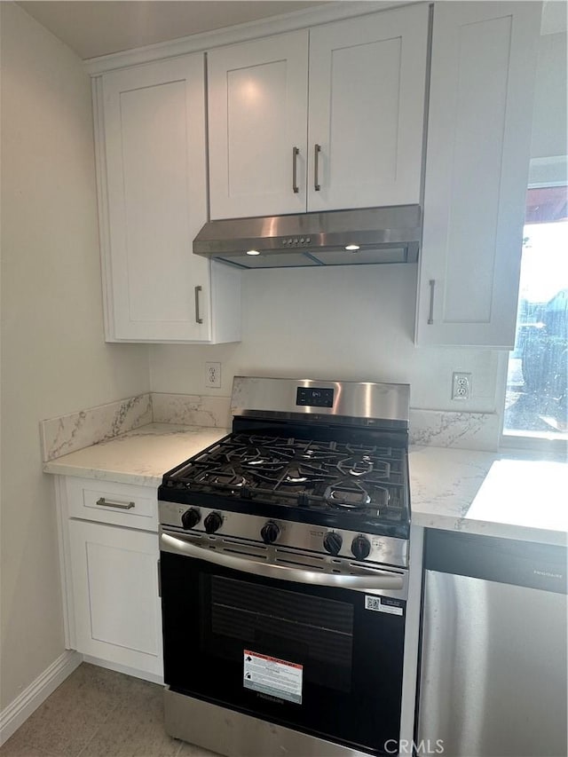 8567 Jasper St, Rancho Cucamonga, CA 91730 - kitchen with stainless steel appliances, exhaust hood, white cabinetry, and light stone countertops