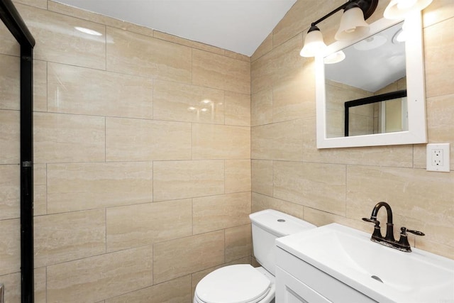 2045 W Clover Ave, Anaheim, CA 92801 - bathroom featuring tile walls, vanity, vaulted ceiling, decorative backsplash, and a shower with shower door