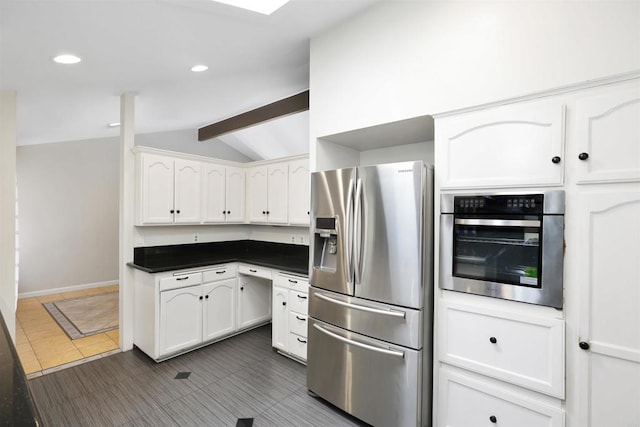2045 W Clover Ave, Anaheim, CA 92801 - kitchen with stainless steel appliances, dark countertops, white cabinets, dark tile patterned flooring, and recessed lighting