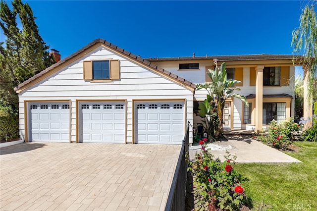22074 Cedardale Dr, Diamond Bar, CA 91765 - view of front of property featuring decorative driveway, an attached garage, and a chimney