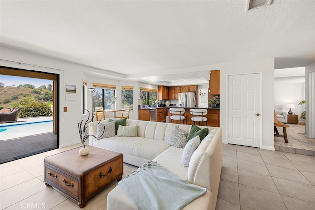 22074 Cedardale Dr, Diamond Bar, CA 91765 - living area with light tile patterned flooring and a textured ceiling