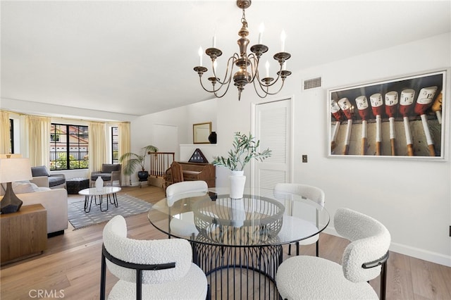 22074 Cedardale Dr, Diamond Bar, CA 91765 - dining room featuring light wood finished floors, a chandelier, and vaulted ceiling