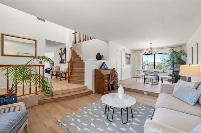 22074 Cedardale Dr, Diamond Bar, CA 91765 - living area featuring a chandelier, wood finished floors, and stairs