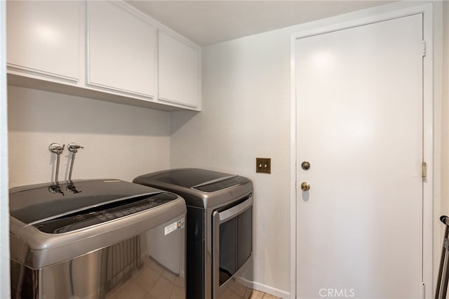 22074 Cedardale Dr, Diamond Bar, CA 91765 - laundry area with cabinet space, independent washer and dryer, and light tile patterned floors