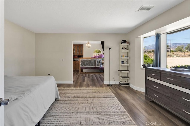10325 Sheep Creek Rd, Phelan, CA 92371 - bedroom with dark wood-style floors and baseboards
