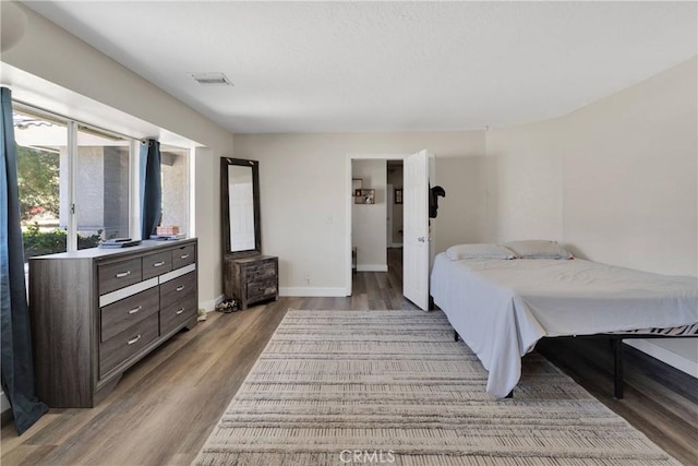 10325 Sheep Creek Rd, Phelan, CA 92371 - bedroom featuring wood finished floors and baseboards