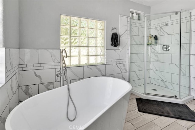 10325 Sheep Creek Rd, Phelan, CA 92371 - bathroom featuring a freestanding bath, tile walls, and a stall shower