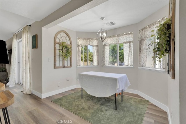 10325 Sheep Creek Rd, Phelan, CA 92371 - dining room with wood finished floors and a chandelier