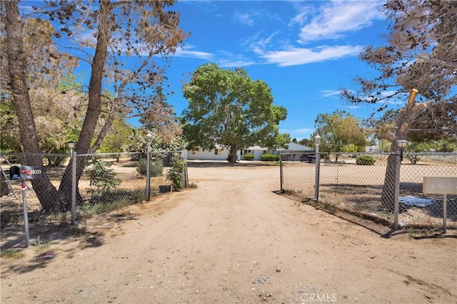 10325 Sheep Creek Rd, Phelan, CA 92371 - view of dirt / gravel road with a gated entry