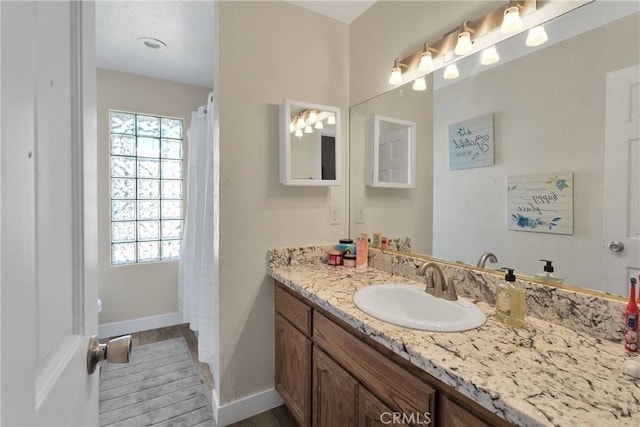 10325 Sheep Creek Rd, Phelan, CA 92371 - full bathroom featuring vanity and wood finished floors