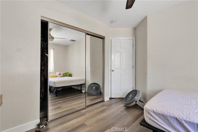10325 Sheep Creek Rd, Phelan, CA 92371 - bedroom featuring wood finished floors, a closet, and ceiling fan