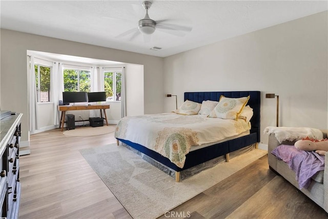 10325 Sheep Creek Rd, Phelan, CA 92371 - bedroom with light wood-type flooring and ceiling fan
