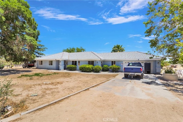 10325 Sheep Creek Rd, Phelan, CA 92371 - ranch-style home featuring dirt driveway, stucco siding, and a tile roof