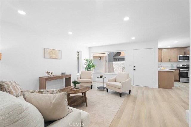 9554 Bickley Dr Unit 8, Huntington Beach, CA 92646 - living room with light wood-type flooring and recessed lighting