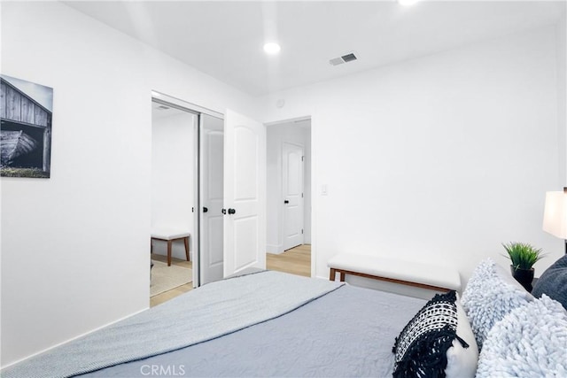 9554 Bickley Dr Unit 8, Huntington Beach, CA 92646 - bedroom featuring wood finished floors, a closet, and recessed lighting