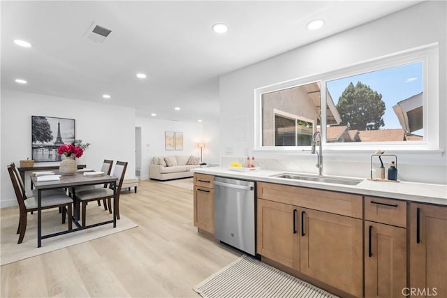 9554 Bickley Dr Unit 8, Huntington Beach, CA 92646 - kitchen featuring dishwasher, light wood finished floors, recessed lighting, light countertops, and brown cabinetry