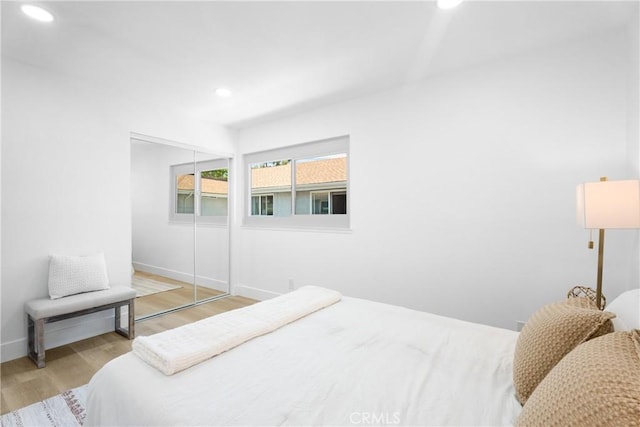 9554 Bickley Dr Unit 8, Huntington Beach, CA 92646 - bedroom with wood finished floors, recessed lighting, and a closet