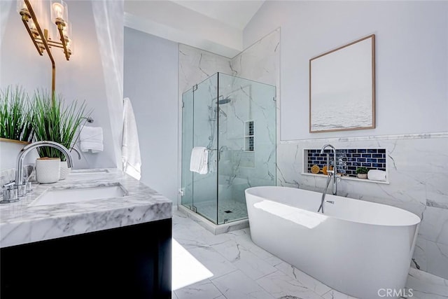 1310 Gates Ave, Manhattan Beach, CA 90266 - full bath featuring a marble finish shower, marble finish floors, double vanity, a soaking tub, and tile walls