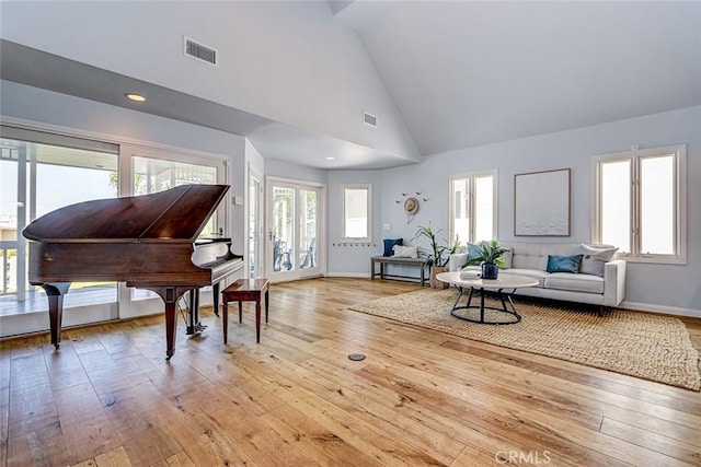1310 Gates Ave, Manhattan Beach, CA 90266 - living room featuring light wood-style flooring, healthy amount of natural light, and high vaulted ceiling
