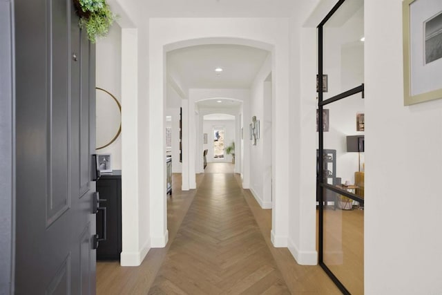 10576 Pinion Trl, Escondido, CA 92026 - corridor featuring arched walkways and baseboards
